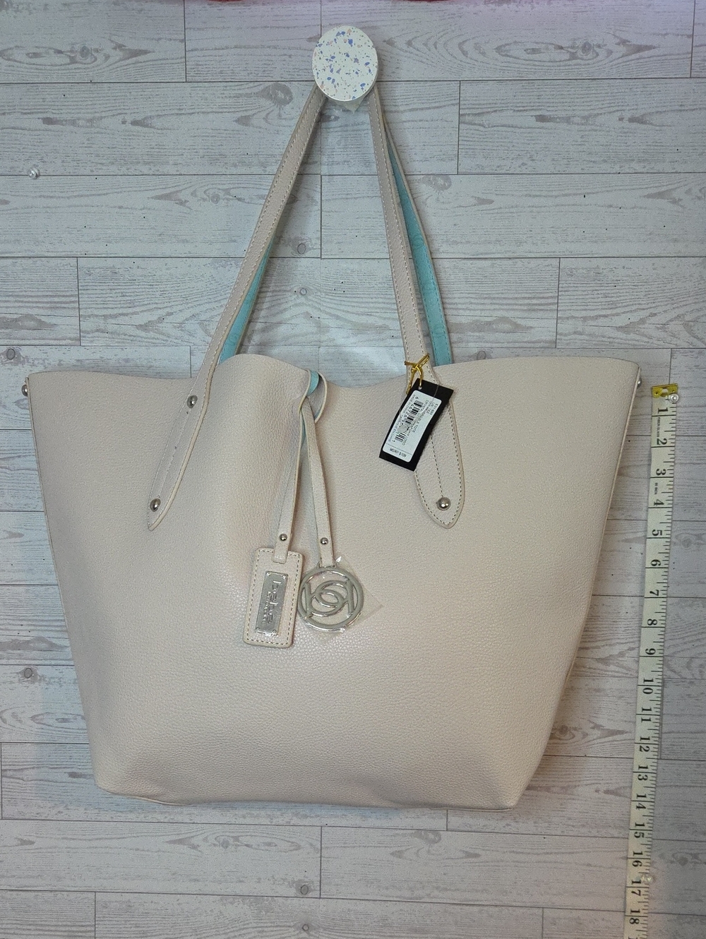 Bebe Mia Reversible Cream Tote Bag with Charm Accent